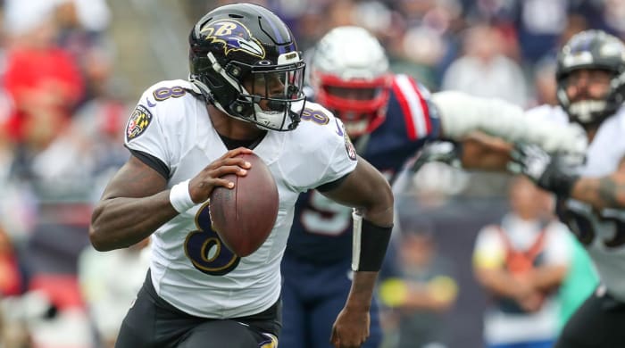 Sep 25, 2022; Foxborough, Massachusetts, USA; Baltimore Ravens quarterback Lamar Jackson (8) runs the ball during the first half against the New England Patriots at Gillette Stadium.